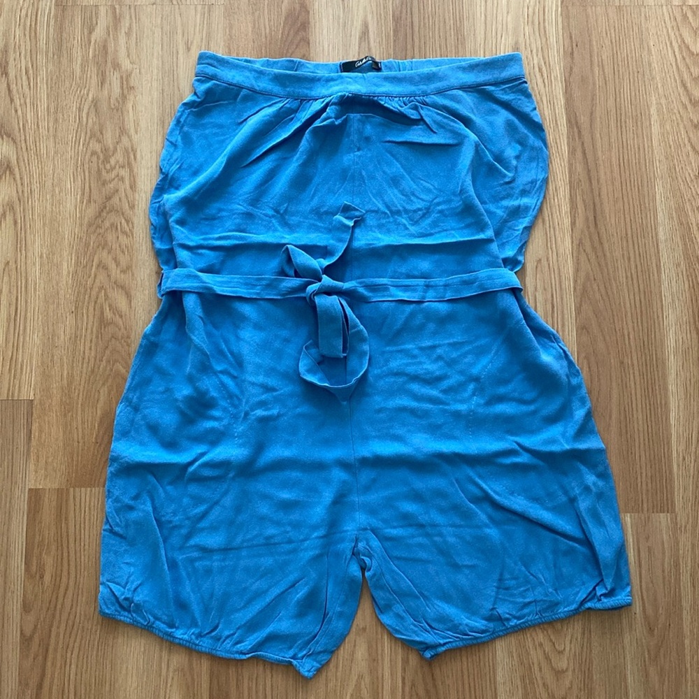 Tube style romper with belt and side pockets.